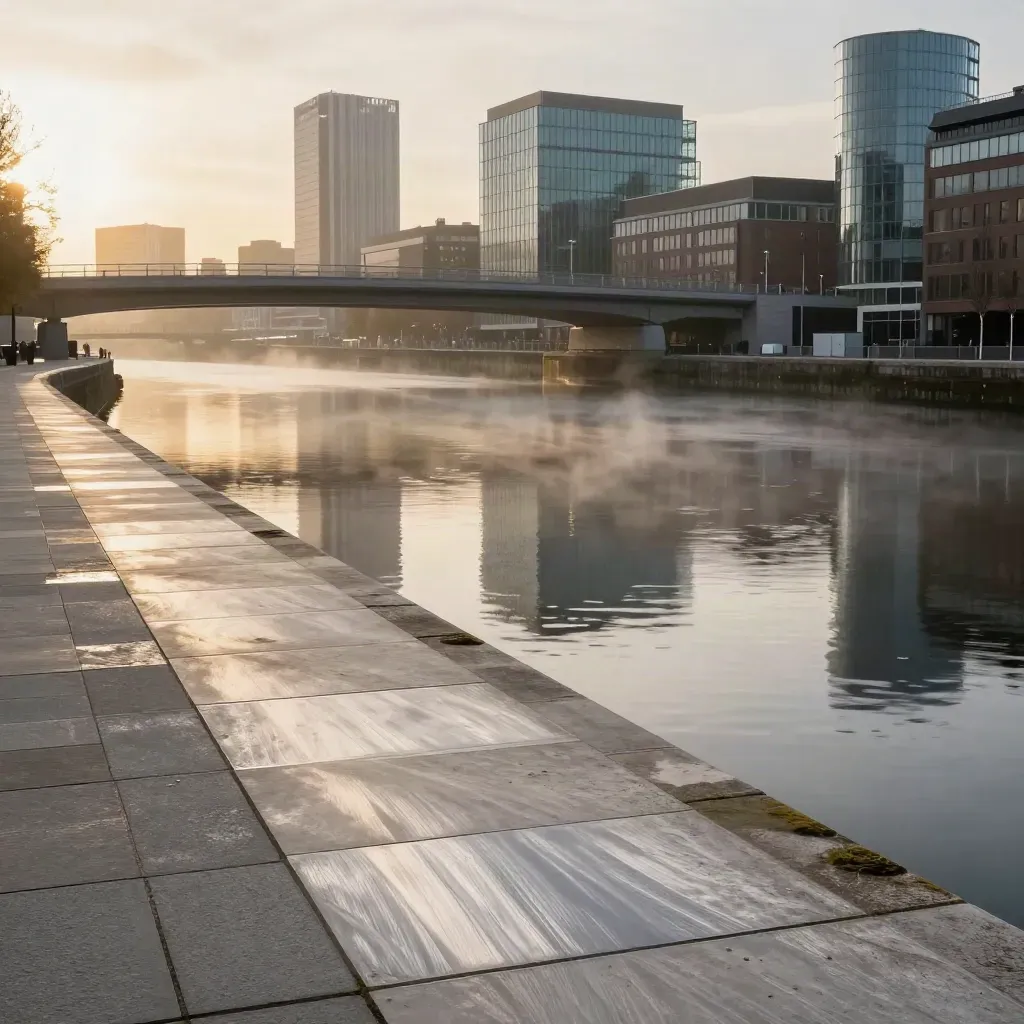 Salford Quays at sunrise with bridge lines, glass towers and calm canal reflections.